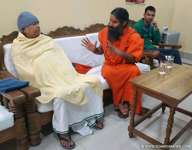 Yoga Guru Ramdev calls on RJD supremo Lalu Yadav in Patna, on Dec 2, 2016. 