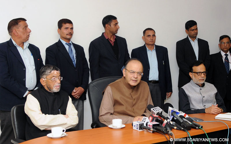 Arun Jaitley briefing the media after the conclusion of the 5th meeting of the GST Council, in New Delhi on December 03, 2016. The Minister of State for Finance, Shri Santosh Kumar Gangwar and the Revenue Secretary, Dr. Hasmukh Adhia are also seen.