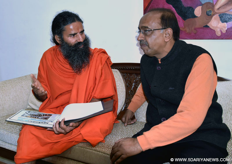 The Yoga Guru, Baba Ramdev meeting the Minister of State for Youth Affairs and Sports (I/C), Water Resources, River Development and Ganga Rejuvenation, Shri Vijay Goel, to promote yoga in sports, in New Delhi on December 06, 2016.