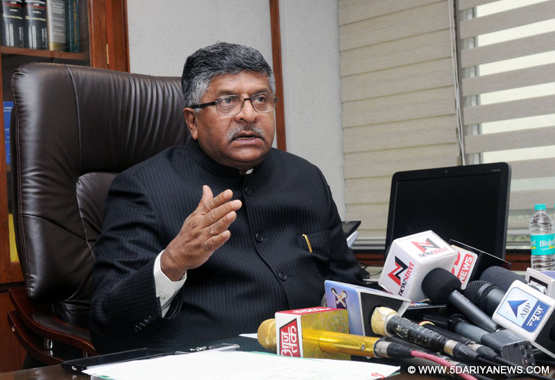 Ravi Shankar Prasad interacting with the media at the DigiDhan Mela - an awareness camp, organised by the Ministry of Electronics and Information Technology (MeitY), in New Delhi on December 17, 2016. The Union Minister for Science & Technology and Earth Sciences, Dr. Harsh Vardhan and the Secretary, Ministry of Electronics & Information Technology, Ms. Aruna Sundararajan are also seen.