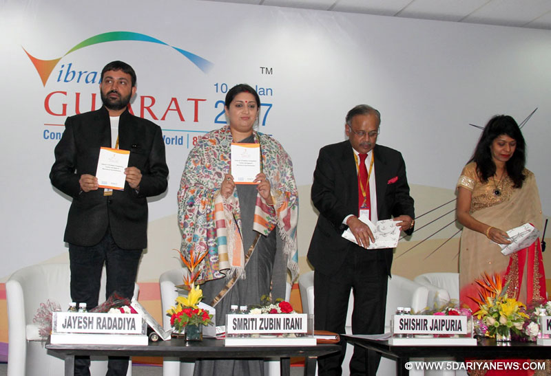 The Union Minister for Textiles, Smt. Smriti Irani releasing an information booklet at the ‘Make in Gujarat’ theme seminar on “Trends & Innovation impacting the Textile Value Chain”, during the Vibrant Gujarat Global Summit 2017, at Mahatma Mandir, in Gandhinagar, Gujarat on January 12, 2017.