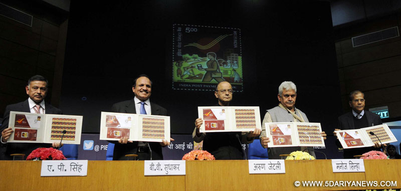  The Union Minister for Finance and Corporate Affairs, Shri Arun Jaitley and the Minister of State for Communications (Independent Charge) and Railways, Shri Manoj Sinha releasing a commemorative stamp, at the launch of the India Post Payments Bank branches, through video conferencing from National Media Centre, New Delhi on January 30, 2017.