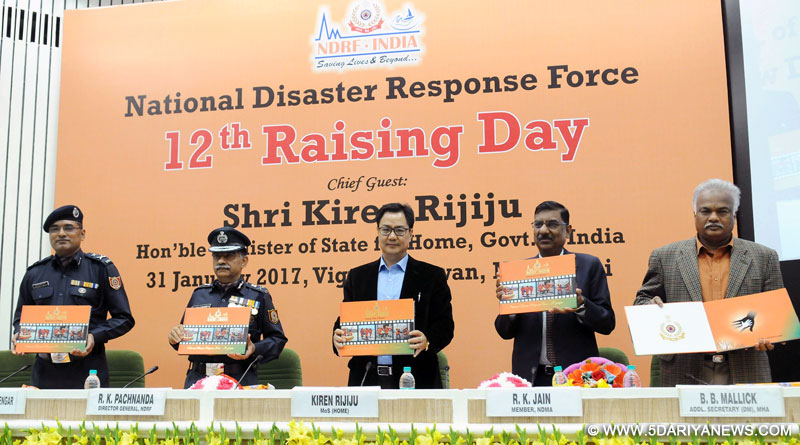Kiren Rijiju releasing a pictorial book on the National Disaster Response Force, at the 12th Raising Day Celebration of the National Disaster Response Force (NDRF), in New Delhi on January 31, 2017. 