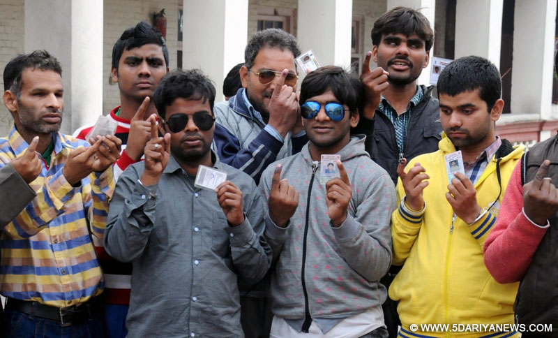 Visually impaired person show forefingers marked with phosphorus ink after casting their vote at a polling station during Punjab Legislative Assembly in Amritsar, on Feb 4, 2017. 