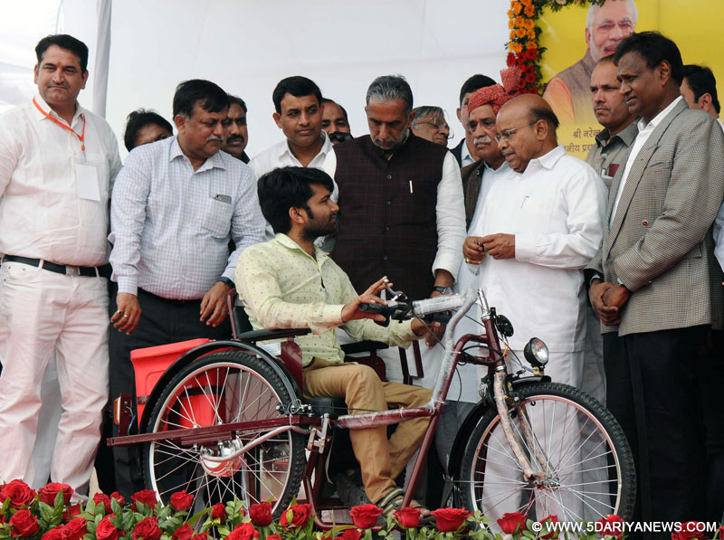The Union Minister for Social Justice and Empowerment, Shri Thaawar Chand Gehlot Distributed the Aids and Assistive Devices to the Persons with Disabilities (Divyangjans) under ADIP Schemes, at the Samajik Adhikarita Shivir, at Rohini, Delhi on March 05, 2017. The Minister of State for Social Justice & Empowerment, Shri Krishan Pal, the Member of Parliament, Shri Udit Raj and other dignitaries are also seen.