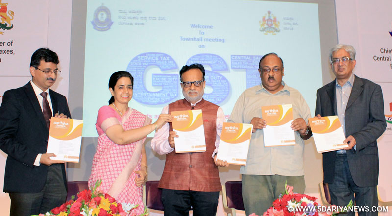 The Revenue Secretary, Dr. Hasmukh Adhia releasing the brochure at the Town Hall Meeting on Goods and Services Tax (GST), in Bengaluru on May 30, 2017.