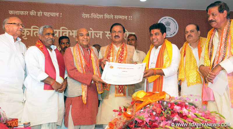 The Minister of State for Culture and Tourism (Independent Charge), Dr. Mahesh Sharma at the launch of the implementation of the ‘‘National Mission on Cultural Mapping of India’ and Block level mega talent hunt programme (Sanskritik Pratibha Khoj Samaroh), organised by the Ministry of Culture, at Goverdhan Block, Mathura District, Uttar Pradesh on June 17, 2017. The Energy Minister of Uttar Pradesh, Shri Srikant Sharma is also seen.