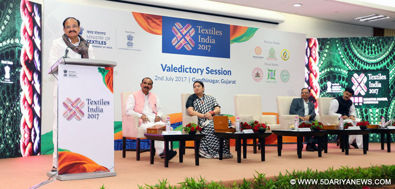  The Union Minister for Urban Development, Housing & Urban Poverty Alleviation and Information & Broadcasting, Shri M. Venkaiah Naidu addressing the gathering at the valedictory session of Textiles India 2017, in Gandhinagar, Gujarat on July 02, 2017. The Union Minister for Textiles, Smt. Smriti Irani, the Vice Chairman, NITI Aayog, Dr. Arvind Panagariya, the Minister of State for Textiles, Shri Ajay Tamta and the Secretary, Ministry of Textiles, Shri Anant Kumar Singh are also seen.
