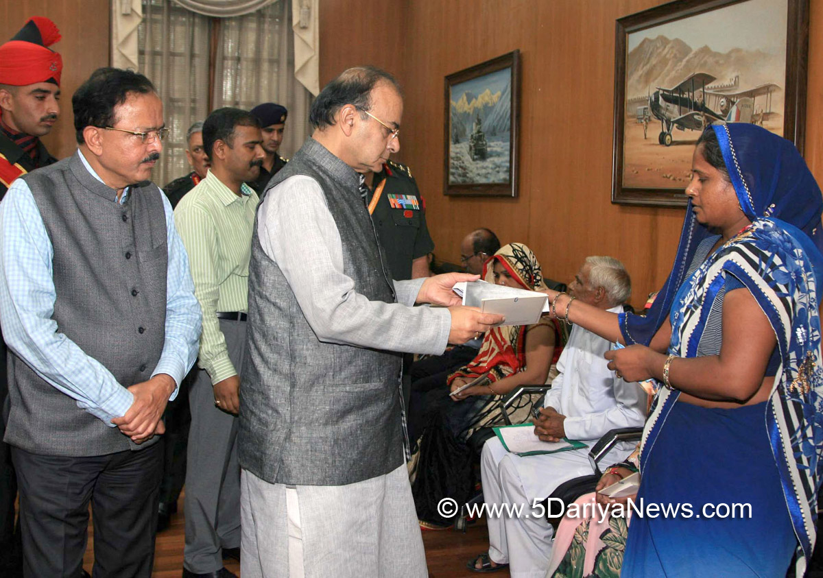 The Union Minister for Finance, Corporate Affairs and Defence, Shri Arun Jaitley handing over additional ex-gratia to the next of kin of battle casualties from the Army Battle Casualties Welfare Fund, which is contributed by concerned citizens, in New Delhi on July 25, 2017. The Minister of State for Defence, Dr. Subhash Ramrao Bhamre is also seen.