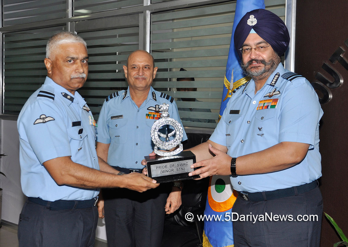 The Chief of the Air Staff, Air Chief Marshal B.S. Dhanoa presenting the Pride of SWAC (Minor Station) Trophy to the Air Officer Commanding, Air Force Station Bhuj, Air Commodore K. Kale, at Headquarters South Western Air Command (SWAC), in Gandhinagar, Gujarat on November 17, 2017.