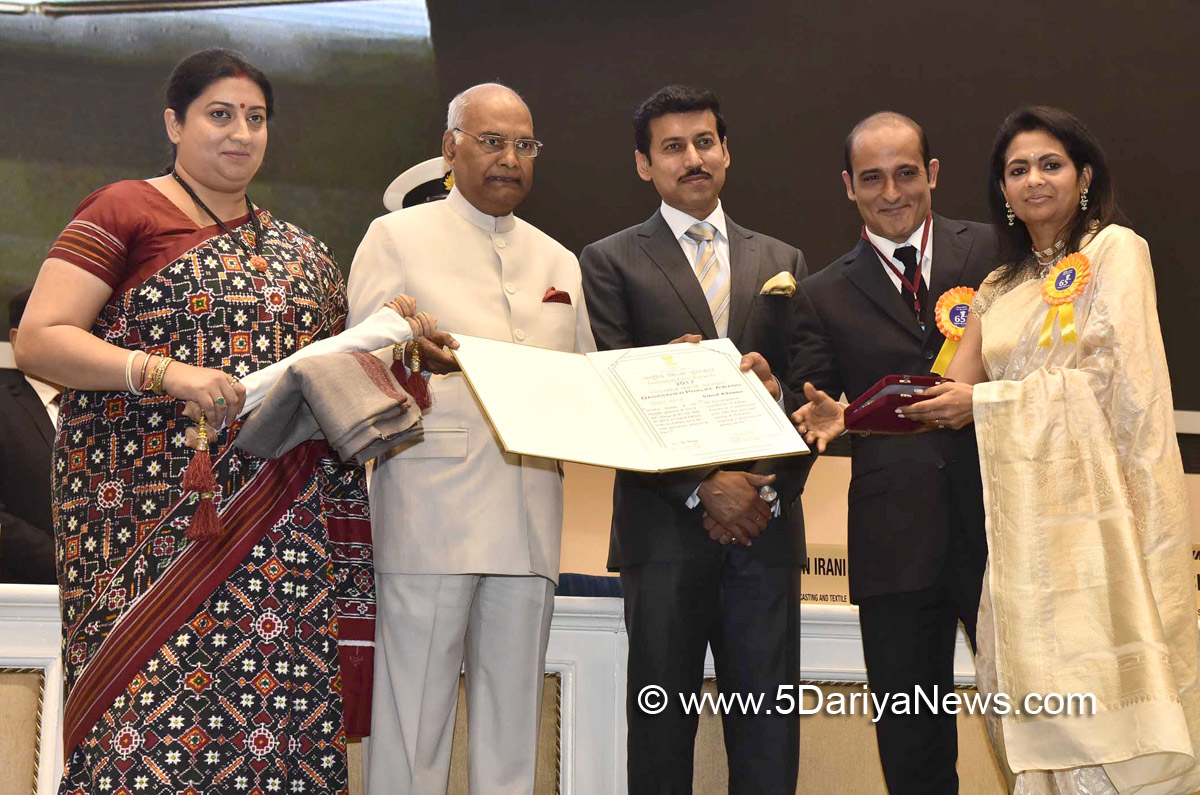 The President, Shri Ram Nath Kovind presenting the Dada Saheb Phalke Award to Veteran Actor Vinod Khanna (posthumous), the award received by his wife Ms. Kavita Khanna and son Akshay Khanna, at the 65th National Film Awards Function, in New Delhi on May 03, 2018.