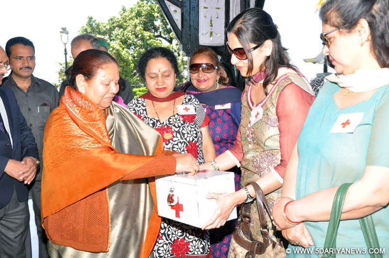 Smt. Urmila Singh, Governor  contributing  towards the Red Cross  at Gaiety Theatre Shimla today.