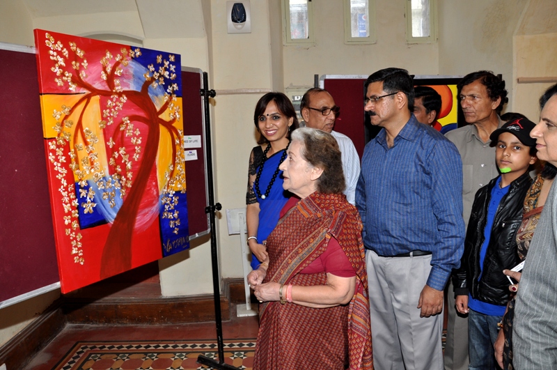 Irrigation & Public Health Minister,  Vidya Stokes evincing keen interest in the painting exhibition of Smt. Vatsala Khera in Gaiety Theatre at Shimla today.