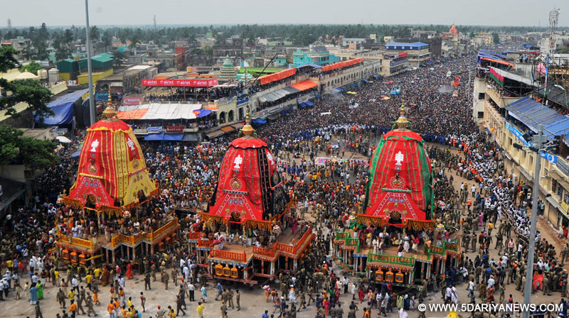 Devotees in large numbers participate in `rath yatra` (chariot procession) in Puri on June 29, 2014. 