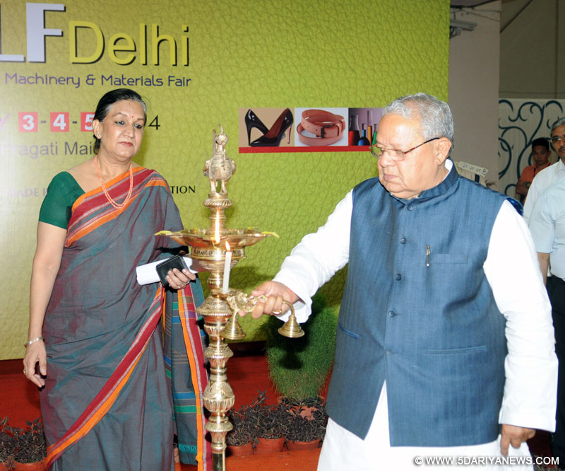 Kalraj Mishra lighting the lamp to inaugurate the India International Leather Fair, in New Delhi on July 03, 2014.