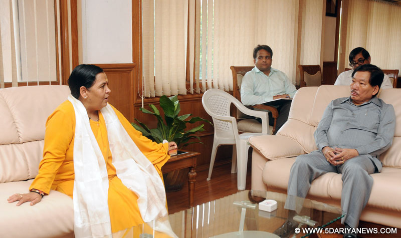  Pawan Chamling meeting the Union Minister for Water Resources, River Development and Ganga Rejuvenation, Uma Bharati, in New Delhi on July 17, 2014.