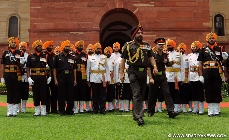 Outgoing Army Chief General Bikram Singh inspects Guard of Honour at South Block in New Delhi on July 31, 2014. 