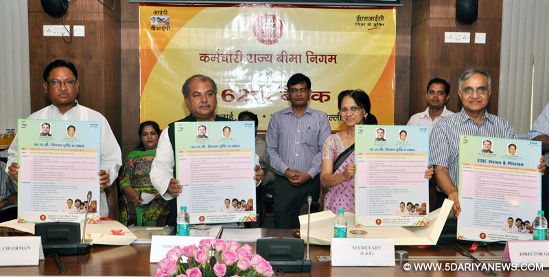 Narendra Singh Tomar releasing a poster on ‘Vision and Mission of ESIC’, at the 162nd Meeting of ESI Corporation, in New Delhi on July 31, 2014.