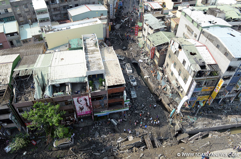Photo taken on Aug. 1, 2014 shows destroyed roads and buildings after gas leak explosions in Kaohsiung, southeast China