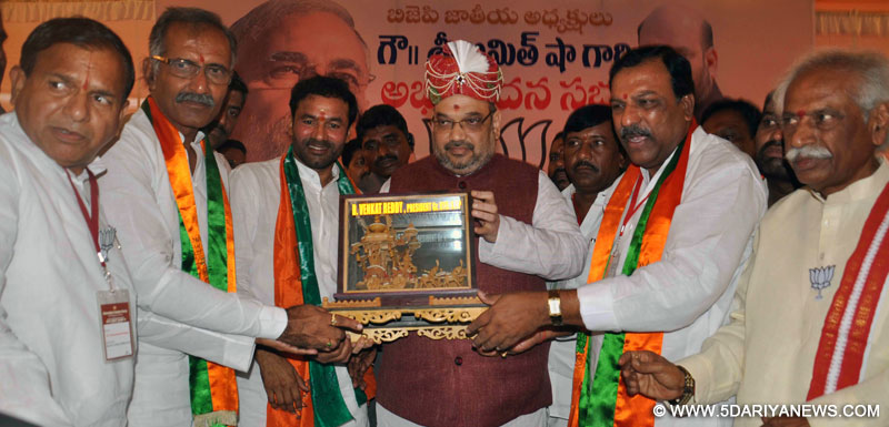 BJP chief Amit Shah being felicitated during a party programme in Secunderabad on Aug 21, 2014. Also seen BJP leader Bandaru Dattatreya.