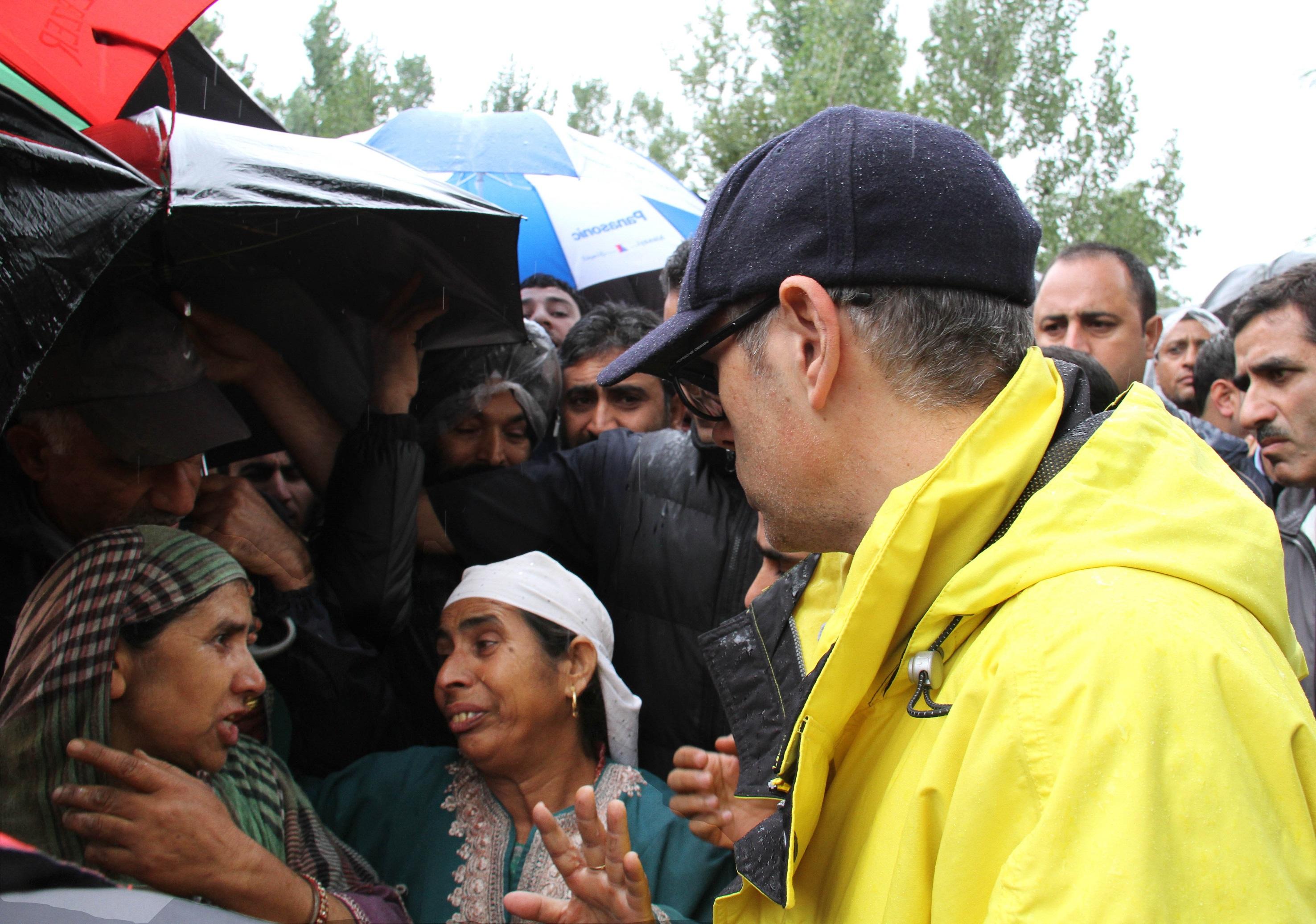 Jammu and Kashmir Chief Minister Omar Abdullah interacts with flood affected people of Jammu and Kashmir on Sept 5, 2014. The chief minister visited Pulwama, Baramulla and Budgam and Srinagar districts of the state to take stock of the situation.