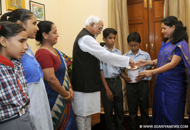  Mohd. Hamid Ansari making his contribution for National Association for the Blind, in New Delhi on September 15, 2014