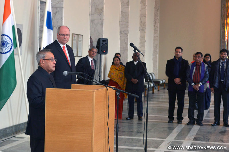 Pranab Mukherjee addressing the Parliament of Finland, at Helsinki, in Finland, on October 16, 2014. The Speaker of Parliament of Finland, Mr. Eero Heinaluoma is also seen.