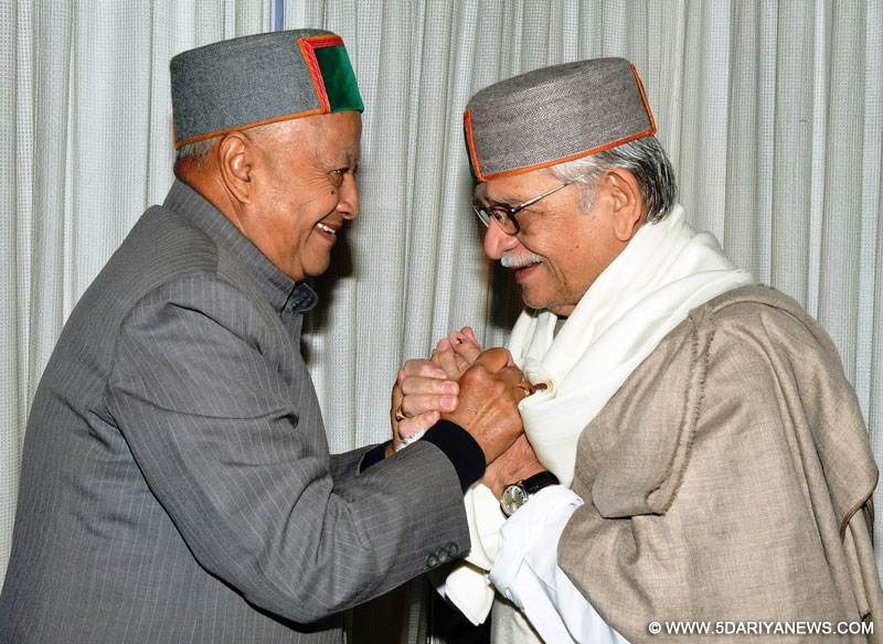 Noted lyricist, poet, writer and filmmaker Gulzar calls on Himachal Chief Minister Virbhadra Singh at his residence in Shimla, on Oct.21, 2014. 