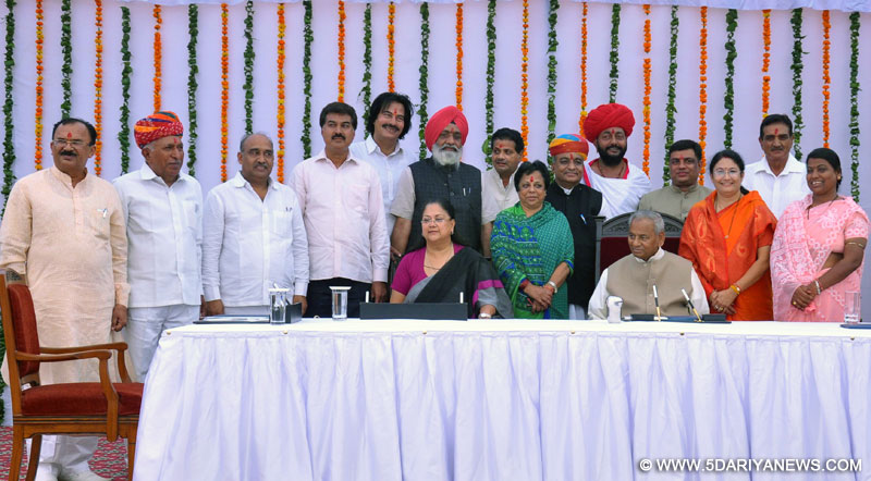 Rajasthan Governor Kalyan Singh, Chief Minister of the state Vasundhara Raje and others during swearing in ceremony of newly appointed cabinet ministers at Raj Bhawan in Jaipur on Oct.27, 2014