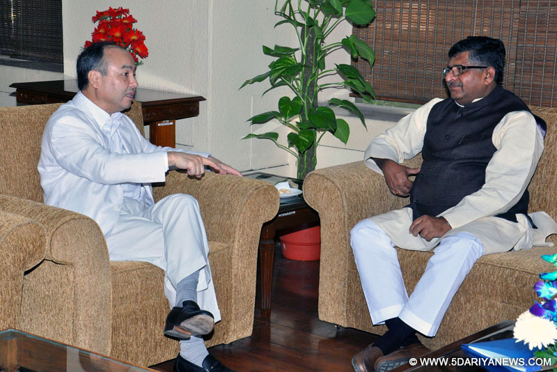 The Chairman and CEO of SoftBank Corporation, Japan, Masayoshi Son meeting , Ravi Shankar Prasad, in New Delhi on October 27, 2014