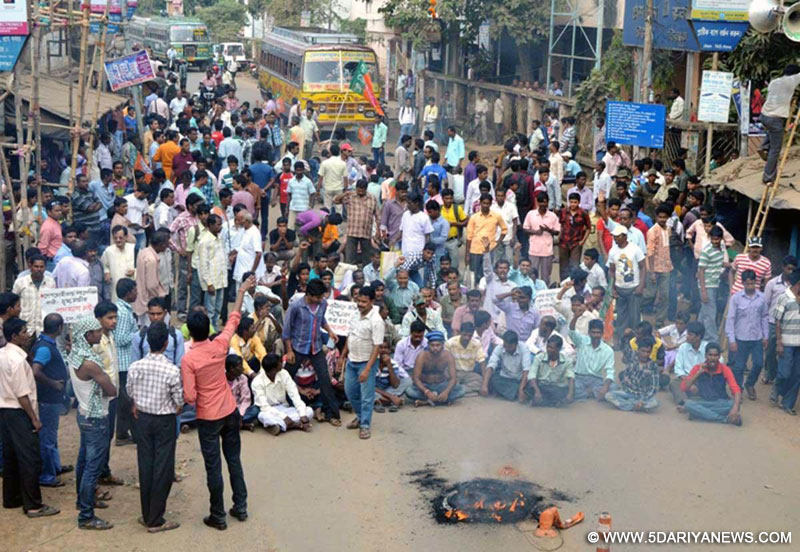 BJP workers stage a demonstration after a BJP delegation led by Mukhtar Abbas Naqvi was taken into preventive custody by West Bengal Police from near a village in Birbhum district where prohibitory orders were clamped after three people died in a clash; in Suri, Birbhum on Oct.30, 2014. 